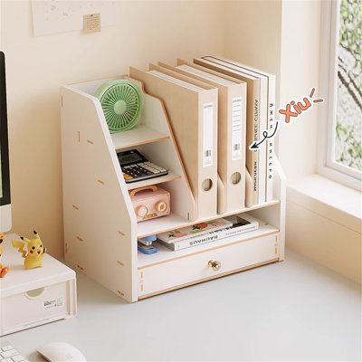 Marketing Strategy: Experience the joy of organizing your study or office with this A4-sized file storage rack. Let your desk become a space planner, decluttering and brightening your workspace. | Red Barrel Studio® Loganjack Solid Wood Desk Organizer in White | 11.53" H X 13.3" W X 9.44" D | Wayfair Organizer Furniture, Pastel Room Desk, Desk Orgaizer, Notebook Organizer, Storage For Room, Cute Decor Items, Orginizer Shelf, Study Stuff, Notebook Storage Ideas