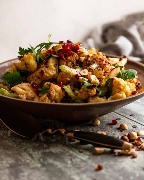 Cauliflower Salad in a rustic bowl, ready to be eaten Pomegranate Recipes Salad, Chicken Marbella, Yotam Ottolenghi Recipes, Roasted Cauliflower Recipe, Roasted Cauliflower Salad, Cornish Hen, Ottolenghi Recipes, Roasted Cauliflower Recipes, Rustic Bowl