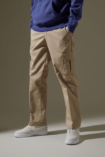 Cargo pants from Dickies in a slim, structured fit. Topped with large cargo pockets, zip-fly with clasp closure and signature Dickies logo tag at back. Dickies started as a humble overall manufacturer in 1922, growing to produce millions of uniforms for the second World War. Today, they're the largest workwear company in the world but still embody the pride + durability of the American working class.Content + Care. Polyester, cotton Machine wash ImportedSize + Fit. Model is 6'2" and wearing size Mens Cargo Pants Outfit, Men Cargo Pants Outfit, Dickies Outfits Men, Dickies Outfit, Cargo Pants Outfit Men, Celana Kargo, Dickies Cargo Pants, Pants Outfit Men