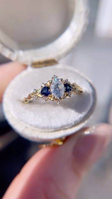 Uma | Engagement Rings on Instagram: "Blue sapphire accents ✨✨" Blue Wedding Rings Gold, Pretty Rings Wedding, Engagement Rings With Blue Accents, Fancy Engagement Rings Unique, Nontraditional Engagement Rings Gold, Blue Gold Engagement Ring, Vintage Nature Engagement Rings, Blue And Silver Engagement Ring, Engagement Rings With Sapphires Accents