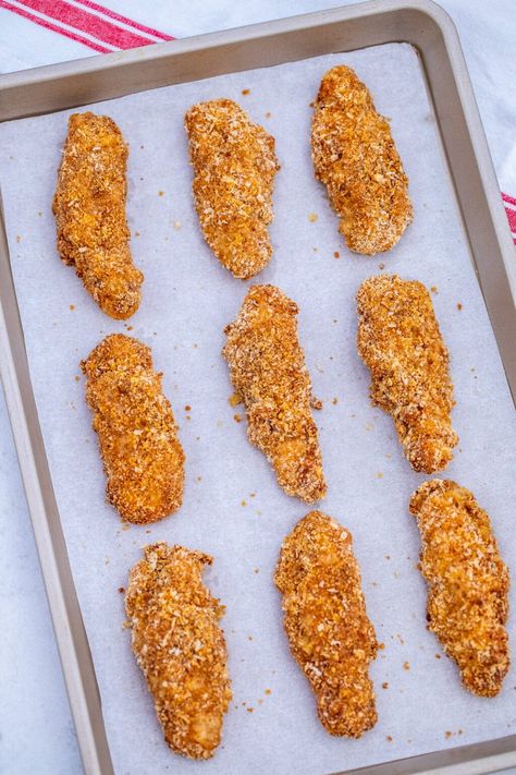 Crispy Oven Baked Chicken Tenders have a crunchy layer of crumbs on the outside and a juicy and tender on the inside! They are also simple and easy to prepare! #chicken #chickentenders #chickenrecipes #sweetandsavorymeals #recipesforkids Simple Chicken Strip Recipes, Breaded Chicken Tenders Fried, Easy Oven Fried Chicken Tenders, Oven Fried Chicken Tenders Crispy, How To Bread Chicken Tenders, Homemade Chicken Tenders Baked, Baked Chicken Tenders Recipes Oven, Baked Fried Chicken Tenders, Easy Chicken Tender Recipes