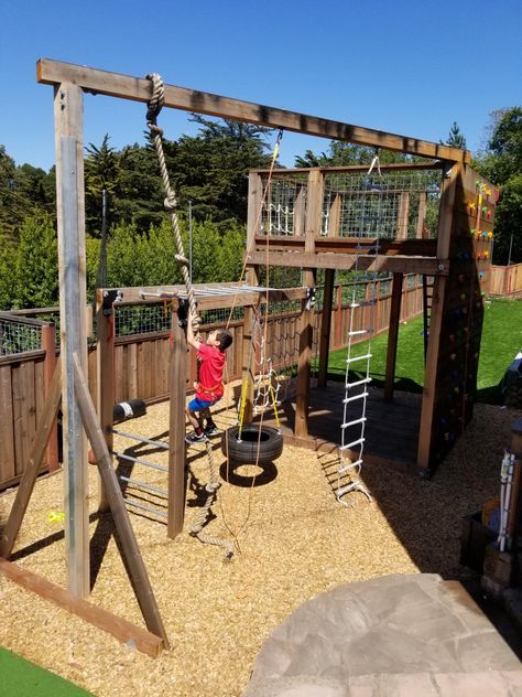 Rock climbing wall, cargo net, rope ladder, climbing rope, fort, tire swing, monkey bars, crossfit Rope Climbing Wall For Kids, Playground Climbing Wall, Homemade Jungle Gym, Cargo Net Playground, Backyard Climbing Structure Kids, Backyard Rock Climbing Wall, Jungle Gyms For Kids Backyards, Backyard Climbing Structure, Diy Jungle Gym Backyards