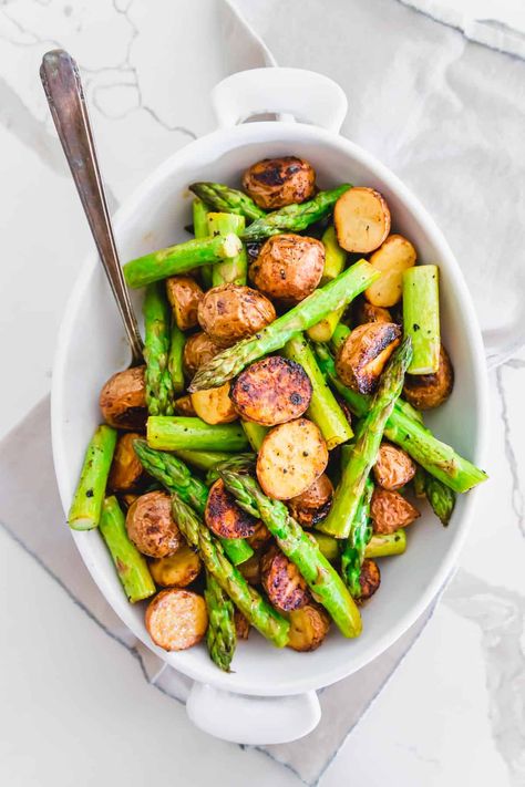 This easy side dish of oven roasted potatoes and asparagus is made all on one baking sheet with garlic balsamic seasoning. Roasted Asparagus And Potatoes, Roasted Potatoes And Asparagus, Asparagus Recipes Soup, Asparagus And Potatoes, Recipe Asparagus, Potatoes And Asparagus, Asparagus Recipes Oven, Best Asparagus Recipe, Roasted Olives