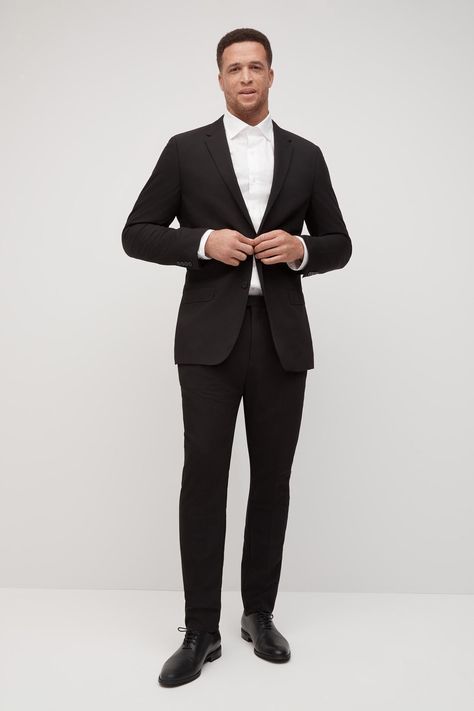 Fulfilled by our friends at SuitShopOur classic black suit is designed for the traditional bridal party. It is sure to set a bold back drop and make any accent colors pop. An absolute necessity, you will wear this again and again and again! Black Men Wedding Suits, Men's Black Suit, Mens Black Suit Jacket, Classic Black Suit, Suit Stores, Black Suit Men, Black Suit Jacket, Groomsmen Suits, Back Drop