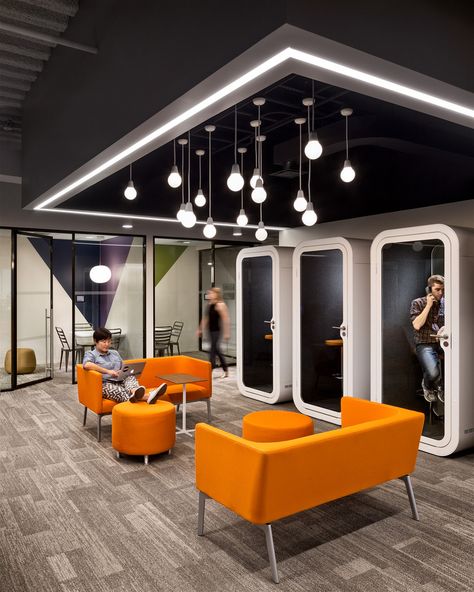 Casual meeting space & telephone booths for privacy at the Slate Magazine offices in NYC. Office Booth, Office Design Inspiration, Corporate Office Design, Office Lobby, City Office, Office Space Design, Office Lounge, Modern Office Design, Corporate Interiors