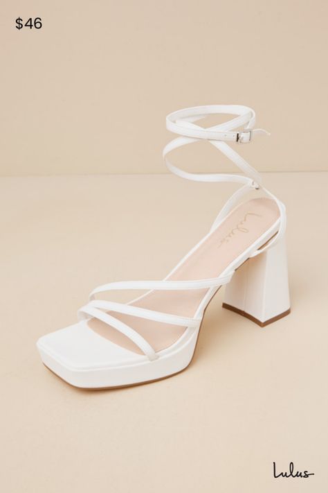 Complete your OOTN to perfection with a little help from the Lulus Antonnia White Strappy High Heel Ankle Wrap Sandals! Smooth faux leather shapes these iconic heels that feature a square footbed and a strappy, asymmetrical upper (all atop a 0.75"" toe platform). Long slender straps sprout from the sides to wrap around the ankle and secure with a silver buckle. A sculpted, sky-high block heel completes the look! 3. 75" wrapped block heel. Lightly cushioned insole. Rubber sole has nonskid marking White Heels For Wedding, White Sandal Heel, Iconic Heels, White Strappy High Heels, Hoco Heels, Hoco Shoes, Graduation Shoes, Hoco Inspo, Strapped Heels