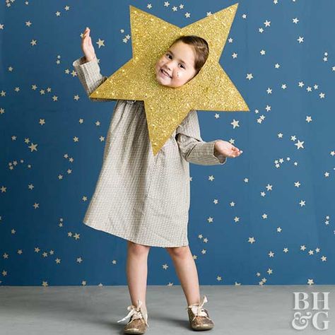 This easy DIY costume will make your child shine bright through an adorable star cutout. Shooting Star Costume, Star Themed Outfits, Nursery Rhyme Costume, Kids Witch Costume, Easy Halloween Costumes Kids, Meme Costume, Nativity Costumes, Handmade Halloween Costumes, Halloween Costumes To Make