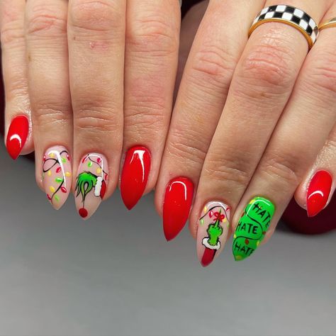 Posted by Zoe Scott: Welcome to the world of Grinch Nail Designs, perfect for adding a whimsical touch to your holiday season style. Covering a range of styles from minima... Grinch Tree Nails, Easy Grinch Nails Designs, Grinch Nails Almond, Christmas Nails Designs Green, Christmas Nail Art Grinch, Grinch Fingernails, Grinch Almond Nails, Grinch Short Nails, Christmas Nail Designs Grinch