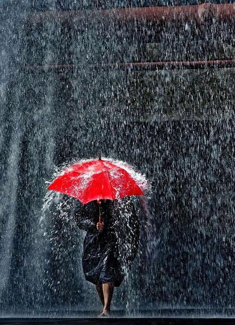 Woman holding a red umbrella & walking in the rain Christophe Jacrot, Rainy Day Photography, Under An Umbrella, Fotografi Urban, I Love Rain, Umbrella Art, Red Umbrella, Rain Storm, Going To Rain