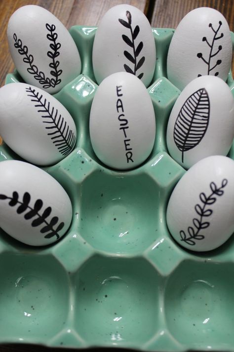 Drawing On Easter Eggs, Sharpie Easter Eggs, Drawing On Eggs, Egg Faces Sharpie, Easter Egg Painting Aesthetic, Black And White Easter Eggs, Modern Easter Egg, Paint Filled Eggs On Canvas, Plant Doodles