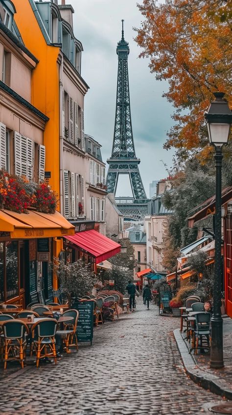 Parisian Cobblestone Charm: A quaint Paris street lined with cafes and vibrant awnings leads to the iconic Eiffel Tower. #paris #cobblestones #eiffel tower #cafes #autumn #aiart #aiphoto #stockcake ⬇️ Download and 📝 Prompt 👉 https://ayr.app/l/qk2c Paris Street Photography, Paris Street Cafe, Paris Streets, Sidewalk Cafe, Parisian Cafe, Beautiful Paris, Star City, Paris Cafe, Colourful Buildings