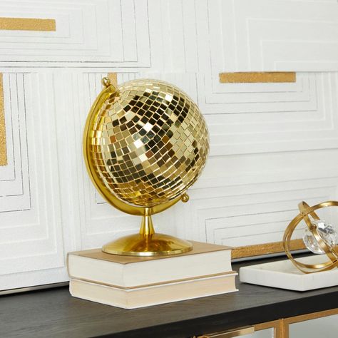 "Gold Glam Stainless Steel Globe Create an artistic display in your living space with this durable and eye catching globe. A unique and distinctive decor that adds character and classic influence design into your living space. Glam up your home space with this golden globe decor on your counters, tables, or desk for a glistening and eye-catching display. This item ships in 1 carton. This world globe measures 8\" diameter. Suitable for indoor use only. Made in India. Glam design. | The Novogratz Mirror Overlay, Globe Decor, Square Mirror, Disco Ball, Steel Metal, Gold Metal, Globe, Living Spaces, Stainless Steel