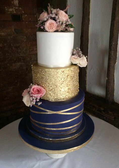 Lisa, 3 tier navy blue and gold theme wedding cake with gold sequin tier and fresh flower decorations Navy And Blush Cake, Gold And Navy Wedding Cake, Navy Blue Gold Wedding Cake, Navy Gold Party Decorations, Wedding Cakes Blue And Gold, Navy Blue Gold Cake, Gold And Blue Wedding Cake, Navy Gold Wedding Cake, Wedding Cake Navy Blue And Gold