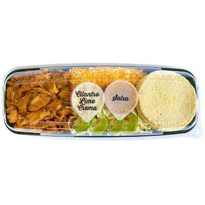 Member's Mark Chicken Taco Kit is the perfect dinner solution because it cooks up quick and is delicious too. This kit includes everything you will need for 12 tacos including seasoned chicken meat, tortillas, lime crema sauce, coleslaw, cheese and sliced limes. Just heat, add the toppings of your choice, and eat. Got leftovers? These keep well in the fridge so you can have some for lunch the next day too. Taco Kit, How To Make Quesadillas, Cilantro Salsa, Home Meals, Members Mark, Chicken Tacos, Meat Chickens, Chicken Seasoning, Coleslaw