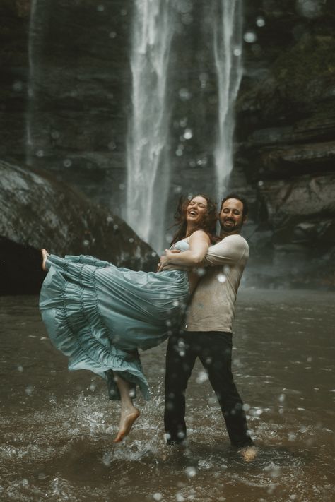 Couple Poses With Dress, Unique Couple Photoshoot Ideas, Engagement Photos Theme, Fantasy Themed Engagement Photos, Water Fall Couple Pictures, Waterfall Engagement Photoshoot, Waterfall Family Photoshoot, Fairytale Engagement Photos, Unique Pre Wedding Shoot Ideas