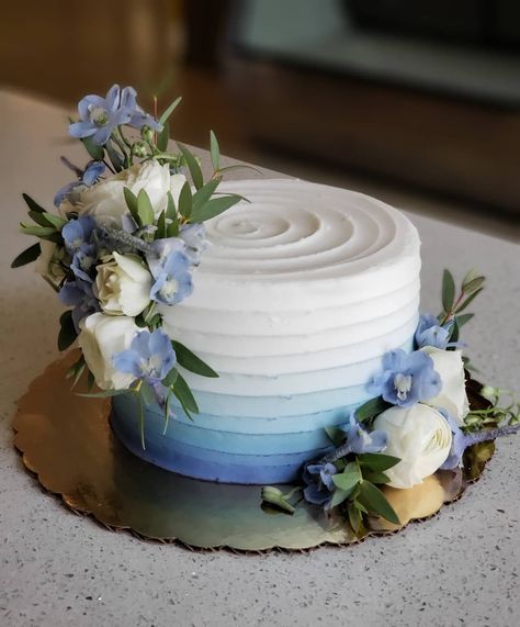 Soft blue ombre with fresh flowers to match 💙  #floralcake #weddingcake #cakedecorating #ombrecake #blueombre #weddingcakes… Blue Gradient Wedding Cake, White And Blue Engagement Cake, Blue Ombré Wedding Cake, 2 Tier Wedding Cakes Simple Elegant Blue, Single Tier Wedding Cake Blue, Blue Floral Cake Birthday, Small Blue Wedding Cake, White Cake Blue Flowers, Small One Tier Wedding Cake