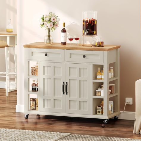 PRICES MAY VARY. 1 Versatile Dining Solution: Elevate storage with the Americana Kitchen Island. Distressed oak top, Off-White finish, antiqued cabinet doors provide classic appeal. Adjustable storage seamlessly merges with modern features. Multi-Functional Versatility: Beyond storage, use as a food & coffee bar, cart trolley, bread rack, microwave & bakers cart, prep counter. Perfect for kitchens, dining, restaurants. Ample Storage Solutions: 2 drawers, sizable cabinet for utensils, dinnerware. Laundry Island Table, Kitchen Counter On Wheels, Microwave Cart Ideas Kitchen Storage, Kitchen Islands For Small Spaces, Island Table For Kitchen, Movable Kitchen Island, Americana Kitchen, Kitchen Island With Storage, Island With Storage