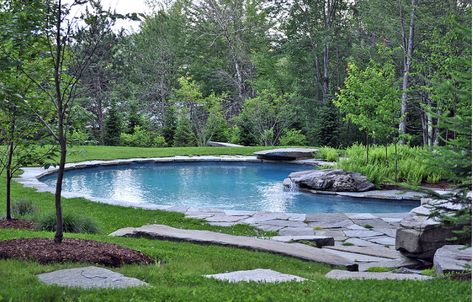 This Vermont pool features minimal pavement and an integrated fire pit, both of which serve to maintain the visual flow of the existing, grassy landscape. Meanwhile, stacked stone slabs inspired a makeshift waterfall. Amazing Swimming Pools, Kempinski Hotel, Stone Pool, Diy Swimming Pool, Cool Swimming Pools, Small Pool Design, Swimming Pond, Natural Swimming Pools, Dream Yard