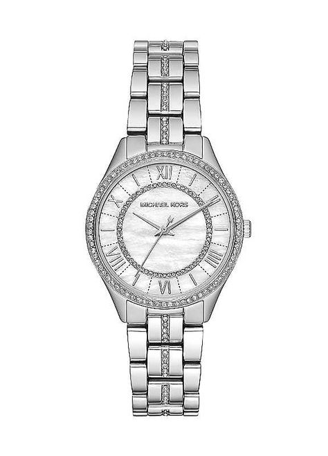 This Michael Kors is a classy ladies watch. A stainless steel case encloses a quartz movement set behind a white mother of pearl dial. The watch fastens with a silver, stone set bracelet and a fold-over deployment clasp. This watch is 50 metres water resistance will allow you to use this watch for swimming but its not guaranteed to be resistant to jumping into the pool. Brand: Michael Kors 50 metres water resistance Michael Kors Watches Women, Silver Womens Watch, Watch Expensive, Michael Kors Watch Silver, Watches Women Michael Kors, Classy Watch, Set Bracelet, Girly Accessories, Jewelry Lookbook