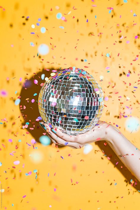 Hand holding a disco mirrors ball with confetti in a party Download this high-resolution stock photo by CACTUS Blai Baules from Stocksy United. Disco Mirror, Confetti Sprinkles, Mirror Ball, Disco Balls, Disco Party, Disco Ball, Product Photography, Art Direction, Confetti