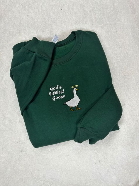 This Gender-Neutral Adult Sweatshirts item by JMACustomShop has 931 favorites from Etsy shoppers. Ships from New Castle, PA. Listed on Sep 15, 2024 Gods Silliest Goose, Funny Crewneck Sweatshirt, Machine Embroidered Clothes, Crew Neck Embroidery Ideas, Silly Embroidery, Hand Embroidery Sweatshirt, Sweatshirt Embroidery Ideas, Duck With Knife, Duck Game