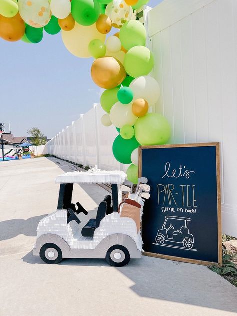 golf summer kids birthday parties, sports birthday, summer birthday ideas, summer birthday themes Golf Gender Reveal Balloon Arch, Cardboard Golf Cart, Golf Party Photo Backdrop, Masters Golf Birthday Party, Golf Pinata, Par Three Birthday, Partee Golf Party, Golf Party Decor, Golf Decorating Ideas Party