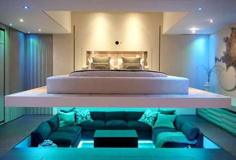 the master bedroom is lowered down over the sunken seating area of the living room ... Futuristic Bedroom, Simple Bed Designs, One Bedroom Flat, Sunken Living Room, Dekorasi Kamar Tidur, Living Modern, Secret Rooms, Space Ideas