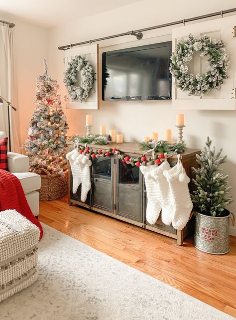 Our Cozy Christmas Living Room Christmas Decor In Small Living Room, Entertainment Stand Christmas Decor, Christmas Decor Ideas For Living Room Tv Stand, Christmas Living Room Apartment, Christmas Decor Entertainment Center, Christmas Decor Ideas For Living Room Tv, Christmas Decor Around Tv, Cozy Christmas Living Room Apartment, Christmas Tv Decor