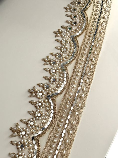 ✦This 8.5cm light gold scalloped zari border trim features elegant mirrors, sequins, and pearl embellishments,  ✦Perfect for enhancing wedding dresses, saris, and craft projects. Ideal for adding a luxurious touch to bridal wear and traditional outfits. Uses: Perfect for wedding dresses, Indian saris, waistbands, chokers, home décor, and craft projects. Material: Made from high-quality Indian zari, adorned with mirrors, sequins, and pearl embellishments on a fabric base 8.5 cm wide PLEASE FOLLOW Embellishments Fashion, Scalloped Mirror, Embellished Wedding Dress, Simple Hand Embroidery Patterns, For Wedding Dresses, Hand Beaded Embroidery, Dress Trims, Elegant Mirrors, Couture Embroidery