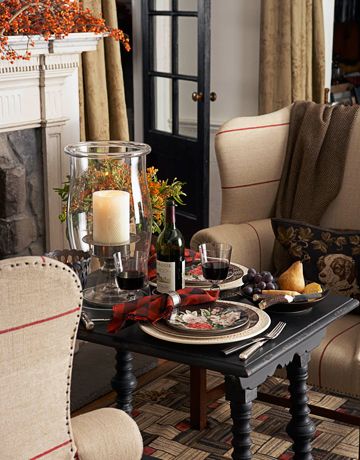 A romantic meal doesn't have to take place in the dining room. Put a small table next to a warm fire for an intimate dinner for two. Designer Ralph Lauren created this cozy table setting by adding a glowing candle and red flannel-patterned napkins. Click through for more fall home decorating ideas. Fall Table Decor, Fall Table, Favorite Kitchen, Ralph Lauren Home, A Fire, Autumn Home, Fall Home Decor, Decoration Table, Bing Images