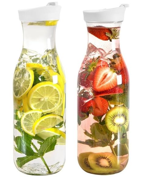 PRICES MAY VARY. BRING STYLE TO YOUR TABLE : Enjoy this set of 2, 50oz (1480ml) water carafe pitcher with lids with your family for dinner, brunch, or a party. They are the perfect size for storing in your refrigerator door, measuring 12 inches tall and 3.5 inches in diameter. MODERN ROUND DESIGN : This plastic pitcher with lid is made of high-quality, food-grade, BPA-free plastic with sturdy construction that ensures its durability. Compared to a glass carafe, It is safer around kids as it is l Juice Dispenser, Pitcher With Lid, Milk Smoothie, Drink Pitcher, Blood Sugar Diet, Water Carafe, Drink Containers, Mimosa Bar, Low Glycemic