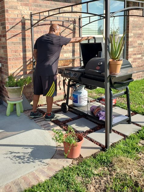 After we extended our patio in 2017 we realized that we had everything EXCEPT a {semi-}permanent home for the grill.    We didn't want a patio that spanned the length of our home or anything that couldn't be changed later if we wanted to.    In our previous home we extended our patio with pavers & let the grass grow in between for an English garden look & feel. We decided to use a similar technique to make a grill landing pad.    How To Make A Grill Landing PadUsing pavers & lava roc Grill Areas Outdoor Diy Backyard, Pavers To Extend Patio, Paver Area For Grill, Paver Patio For Grill, Diy Backyard Grill Area, Patio Extended With Pavers, Small Paver Pad For Grill, Renter Backyard Makeover, Grill Pad Off Patio Diy