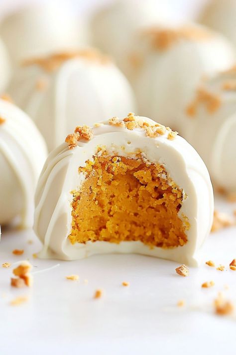 No-bake pumpkin cheesecake balls are creamy, spiced bites coated in white chocolate. They're easy, delicious, and perfect fall treats everyone will love. Pumpkin Balls No Bake, No Bake Pumpkin Cheesecake Balls, No Bake Pumpkin Balls, Pumpkin Spice Cake Balls, Pumpkin Cake Balls, Pumpkin Cheesecake Balls, Holiday Deserts, Pumpkin Truffles, Pumpkin Balls