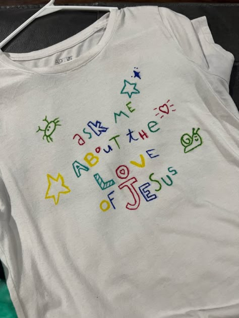 Christian Tshirt Design Ideas Aesthetic, I Love Jesus Shirt, Fabric Paint Tshirt Ideas, Diy Christian Shirts, Jesus Merch Aesthetic, Aesthetic Christian Shirts, Painting Shirts Ideas, Painted Tshirts Diy Ideas, Tshirt Embroidery Diy