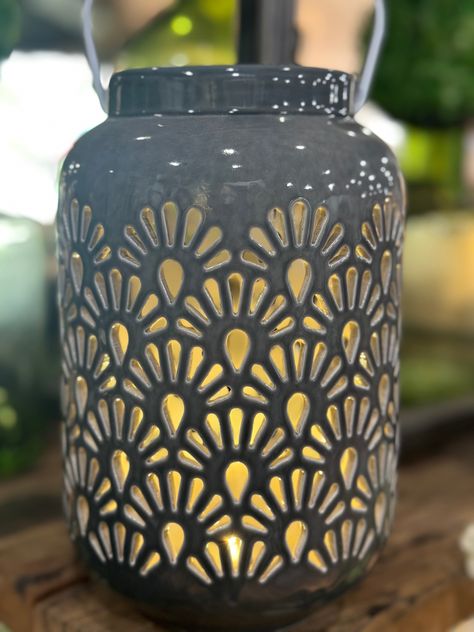 Light up your space with our elegant and exclusive 8" LED Shell Ceramic Lantern. Crafted with intricate shell detailing, this lantern creates a warm and inviting atmosphere with its soft LED light. Perfect for any room or outdoor area, add a touch of luxury to your decor. 8”H X 4”W Ceramic Lantern Ideas Clay, Ceramic Lantern Ideas, Shell Ceramics, Pottery Lantern, Pottery Luminaries, Ceramic Luminaries, Ceramics Lantern, Pottery Lanterns Handmade, Clay Lantern