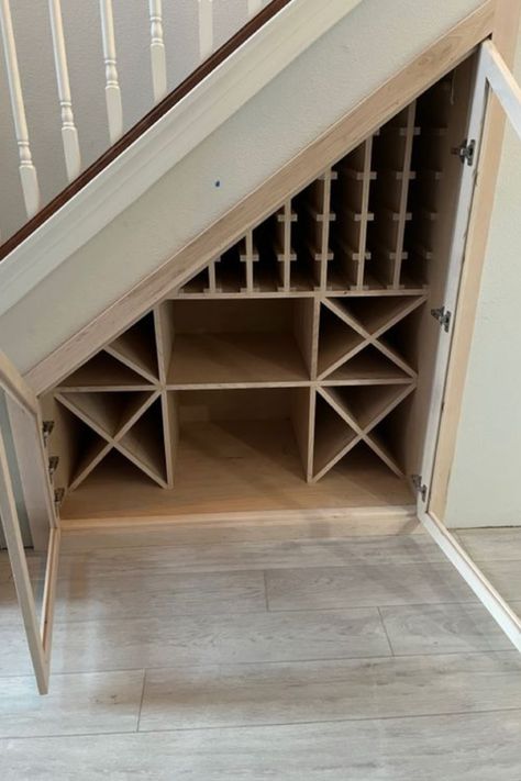 Who knew that little nook under your stairs could transform into a wine lover's dream? 🏡✨ Check out our clever under-stairs wine storage ideas that mix practicality with a touch of elegance. Say 'cheers' to smart space-saving! 🥂 Ready to uncork the full list of ideas? Dive into our blog post now! #GoTinySpace #UnderStairsWineStorage Basement Stairs Wine Cellar, Under Stairs Wine Storage With Fridge, Small Under Stairs Wine Storage, Understair Wine Storage, Wine Under The Stairs, Under Stair Wine Rack, Understairs Wine Storage Staircases, Wine Cupboard Under Stairs, Under The Stair Wine Cellar