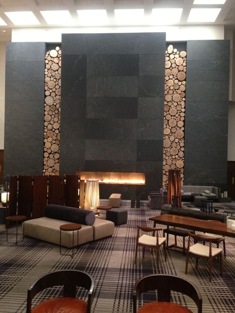 love the wood storage and bold dark accent color. Hotel Lobby Fireplace Design, Hotel Lobby Fireplace, Lobby Furniture, Space Hotel, Modern Lodge, Old House Interior, Hotel Lobby Design, Hotel Inspiration, Firewood Storage