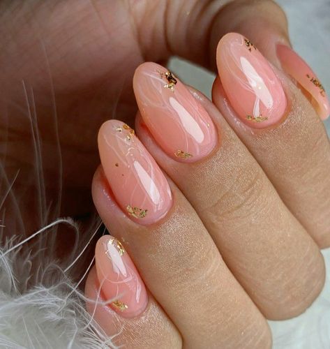 Almond shaped nails. Jelly pink nails, salmon pink nails, light pink nails, peach color nails, jelly pink nails with golden flakes, nails with golden flakes, almond nails with gold flakes, almond pink nails with golden flakes, almond pink nails, glossy nails Pink Nails Gold Flakes, Golden Flakes Nails, Pink Glossy Nails, Jelly Pink Nails, Almond Nails Pink, Glossy Nails, Peach Nails, Quartz Nail, Almond Acrylic Nails