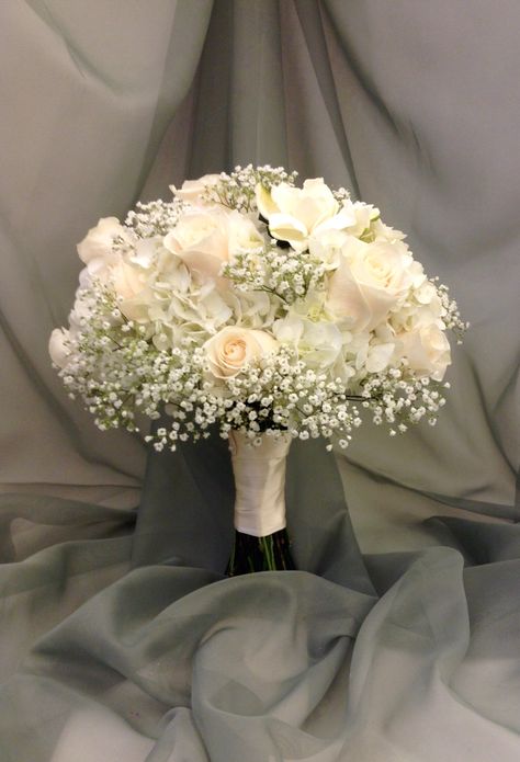 White bridal bouquet with hydrangea, roses, babies breath and gardenias by Nancy at Belton hyvee. Gardenias Wedding Bouquet, White Rose Bouquet Prom, Baby Breath And White Roses Bouquet, Gardenia Bouquet Wedding, Bridal Bouquet With Baby Breath, Wedding Bouquets Carnations, Simple White Bouquet Wedding, White Rose And Baby Breath Centerpiece, White Roses And Baby Breath Bouquet