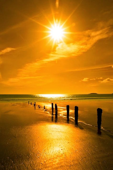 Golden sunshine over the beach breakers and blue Atlantic sea in Youghal County, Cork Ireland on a summers day. Amazing Sunsets, Wallpaper Vintage, Beautiful Sunrise, Beautiful Sky, Beautiful Sunset, The Sand, Sunrise Sunset, Beautiful World, Beautiful Landscapes