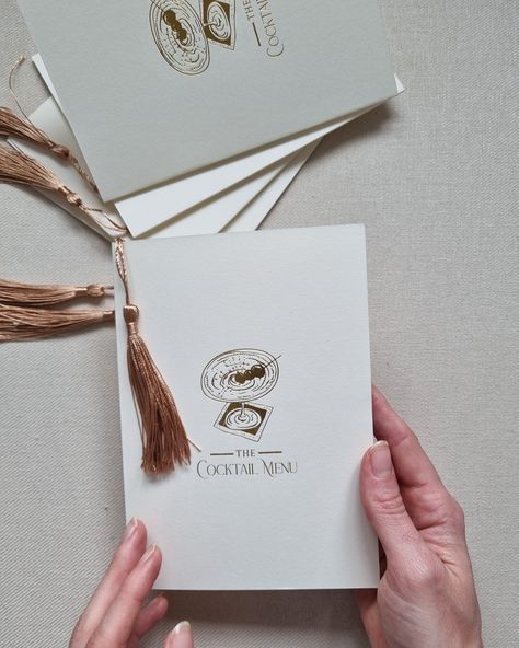 Calling all cocktail lovers Focusing on simplicity with a touch of 1930's glamour our foil printed tassel cocktail menus where a big hit! #bespokeinvitations #luxurystationery #elegantweddinginvitations #weddingstationer #weddingstationery #weddingstationary #weddinginvitations #weddingmenu #weddingcocktails #weddingcocktailhour #weddingidea #weddingtrends #weddingbranding Menu With Tassel, Wedding Invitation With Tassel, Wedding Menu Tassel, Wedding Menu Handwritten, Calligraphy Menu Wedding, Handwritten Wedding Menu Cards, Bespoke Invitations, Cocktail Hour Wedding, Luxury Stationery