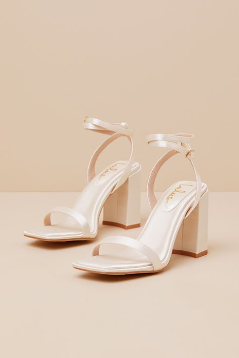 All your most fabulous looks just wouldn't be complete without the Lulus Akrisna Champagne Satin Ankle Strap High Heel Sandals! These sensational heels have a sleek satin composition that shapes a square footbed, a slender toe strap, and a matching heel strap that supports ankle-wrapping straps with an adjustable gold buckle. A chunky, sculpted block heel lends a unique finish to this chic design. 3. 75" block heel. Cushioned insole. Felted rubber sole has nonskid markings. Man made materials. I Chunky Prom Heels, Shoes For Satin Dress, Champagne Heels For Spring Prom, Champagne Heels With Ankle Strap, Champagne Heels With Heel Strap, Champagne Colored Heels, Heels Champagne, Hoco Heels, Champagne Heels With 4-inch Heel