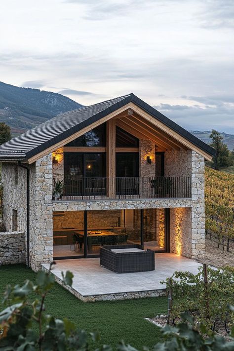 Modern French chalet house facade with geometric stone ground floor and timber chalet second floor provencal vineyard in the background. Check out all of these charming French chalet house exteriors that perfectly blend rustic elegance and cozy, alpine vibes. French Vineyard House, Timber And Stone Houses, Stone And Timber House, Rustic Modern Home Exterior, Modern Old House, Modern Houses Exteriors, Modern Chalet Exterior, Small Chalet Design, Modern Architecture House Exterior