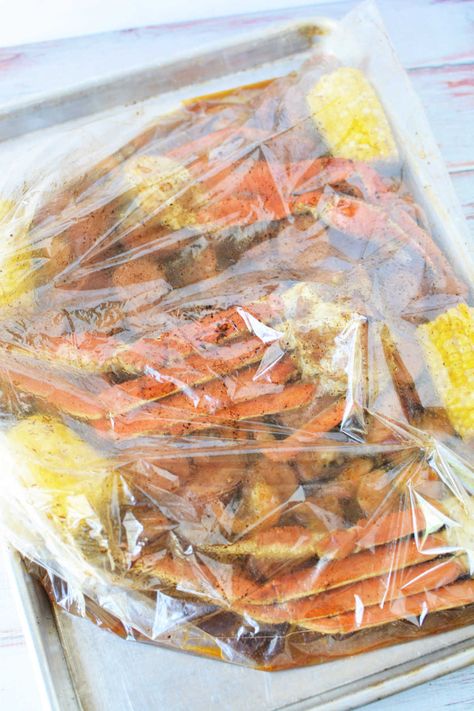 How to cook seafood in a bag in the oven! Crab boil in a Reynolds oven bag with corn, sausage and shrimp in 30 minutes tender with Old Bay. Seafood In A Bag, Shrimp Boil In Oven, Crab Boil Recipe, Steamed Crab Legs, Cooking Crab Legs, Cooking Crab, Crab Legs Recipe, Oven Bag, Beef Recipe Instant Pot