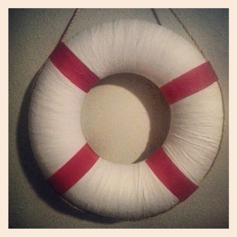 Nautical party DIY lifesaver. Made from inflatable dollar store swim ring wrapped with white and red streamers and the rope to add the final touch. May add an anchor in front or letter stickers spelling "Welcome Aboard". Nautical Window, Titanic Birthday, Vbs Shipwrecked, Gilligans Island, Sailor Party, Bon Voyage Party, Boat Theme, Nautical Birthday Party, Island Party