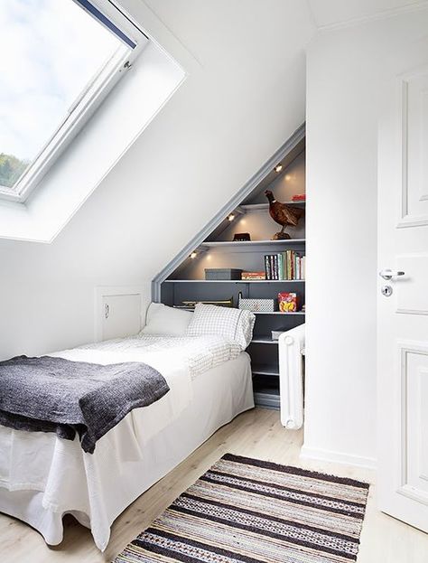 a practical small attic bedroom with a built in storage unit Slant Roof Bedroom, Attic Storage Ideas, Small Attic Spaces, Small Loft Bedroom, Small Loft Spaces, Small Attic Bedroom, Small Attic Room, Attic Room Ideas, Small Attic Bathroom