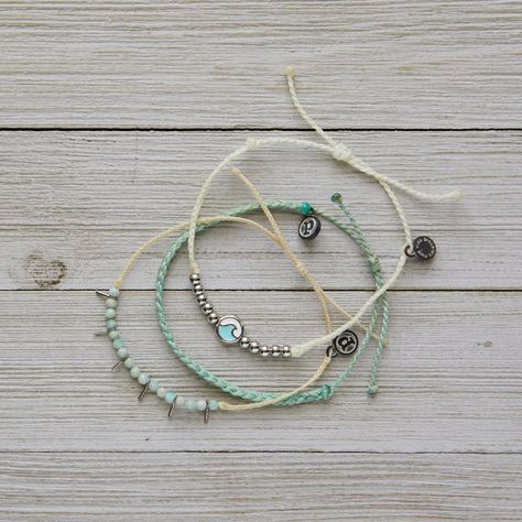 This Set From Pura Vida Comes With Three Bracelets; A White String Bracelet With Silver Beads And Turquoise + Silver Ocean Wave Charm, A Mint Mini Braided Bracelet, And A Cream String Bracelet With Sea Glass Beads And Silver Spike Details. Nwot: The Item Is In Perfect Condition - 100% Waterproof - Wax Coated - Adjustable From 2-5 Inches In Diameter Please Reach Out With Any Questions On This Item! . Bundle + Save! Enjoy 15% Off When You Purchase Two Or More Items From My Closet Bohemian | Festiv Ocean Waves, Sea Glass Beads, Bracelet Pack, Pura Vida Bracelets, Braided Bracelet, Ocean Wave, String Bracelet, Bracelet Crafts, Braided Bracelets