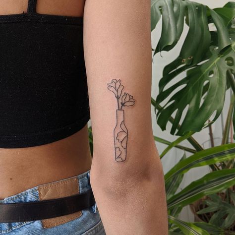 Upper Arm Tattoo Placement, Flower Vase Tattoo Simple, Vase Tattoo Back Of Arm, Minimal Vase Tattoo, Vase Tattoo Simple, Vase Flower Tattoo, Vase With Plant Tattoo, Vase Tattoos, Flower In Vase Tattoo