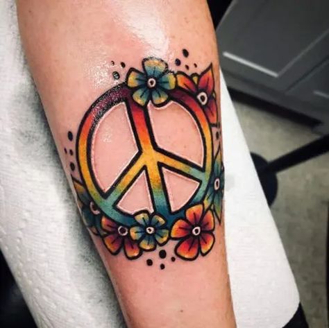 25 Best Peace Tattoo Designs to Enhance Your Beauty | Styles At Life Hippie Flower Tattoos, Inner Peace Tattoo, Harmony Tattoo, Knuckle Tattoo, Peace Sign Tattoos, Peace Tattoo, Happiness Tattoo, Peace Tattoos, Green Tattoos