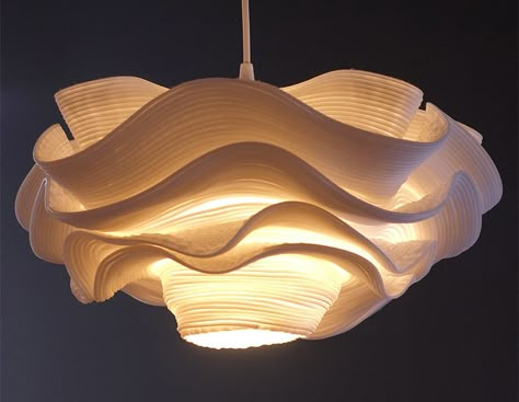 This unique pendant lamp may look like a fluffy cloud hanging down from the ceiling, but upon closer inspection is unexpectedly crafted from zippers. Design Objet, Ethereal Light, Unique Pendant Lights, Kitchen Lights, Metal Canopy, Wooden Lamp, Elegant Lighting, Unique Pendant, The Source